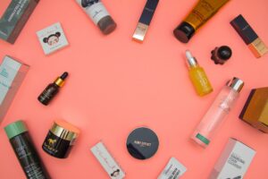 Why should use toner after washing face? stylish beauty products arranged on pink table