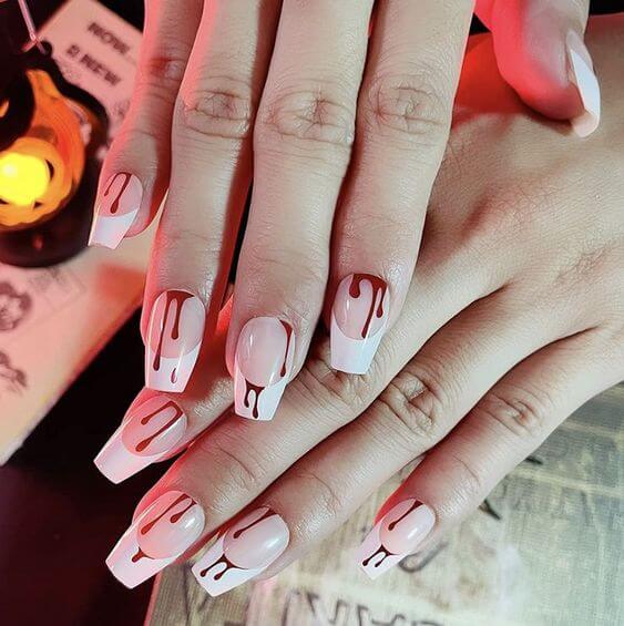 7 Best Halloween Blood Nails 1. Press On Nails Vampire Fangs 
BTArtbox French nails feature a bleeding design, which is perfect for completing a cute and adorable darkness Halloween look.