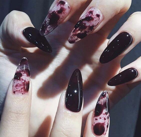7 Best Halloween Blood Nails 1. Press On Nails Vampire Fangs 
Halloween Nails Cosydays Stiletto Punk Witches Press on Nails Black and Red  create a creepy effect on the nails, making them well-suited for a variety of sophisticated Halloween looks such as vampires, witches, and jokers.