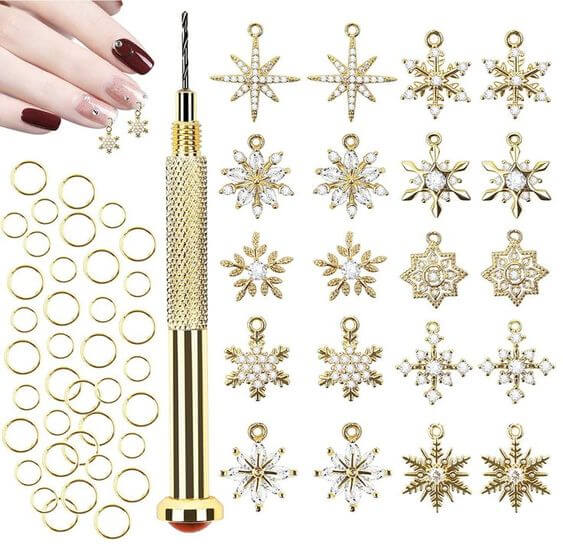 THE 12 BEST SNOWFLAKE NAIL DESIGN IDEAS & PRODUCTS 5. Piercing Gold Nail Rhinestone

