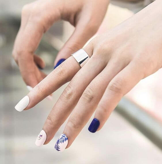 11 Blue Short Nail Designs: Fake Nails & Nail Strips 1. Press-On Nails Short Dark blue and white nails Kiss imPRESS dark blue and white fake nail kit goes well with summer because it looks refresh overall. 