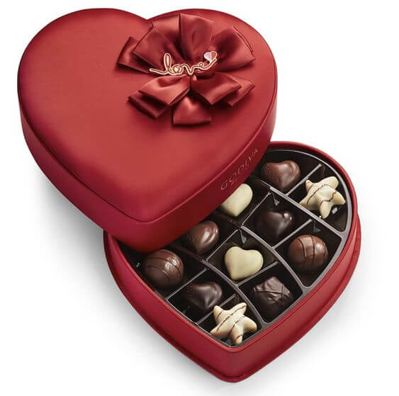 12 Best Valentine's Day Gifts For Her 4. Chocolate Gift   Godiva Chocolatier Chocolate Red Fabric Heart Valentine’s Gift Box Is there anything that melts the awkward atmosphere as quickly as sweet chocolate? If you're preparing a confession, get ready to jump into her heart with sweet food.