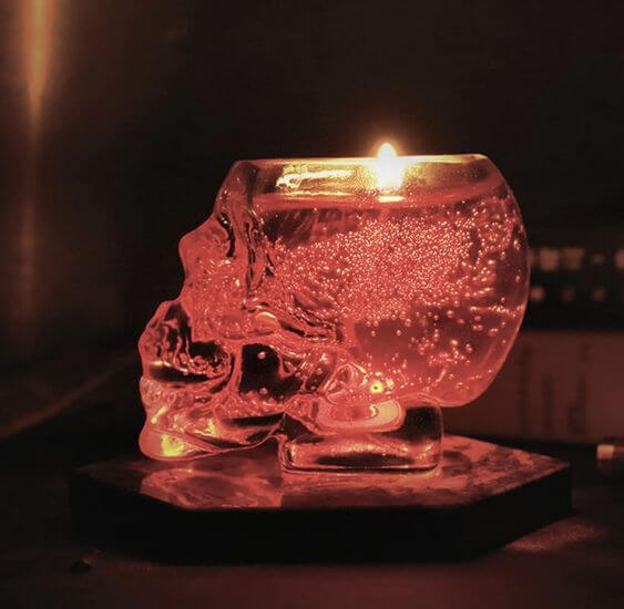 Top 4 Skull Candles For A Spooky Ambiance 1. Grass Jar Skull Candle
MSTR Grass Jar Skull Candle combines an intriguing design with a touch of red sparkle. Once the candle has burned down, it reveals a thick, transparent glass jar in the shape of a skull. 