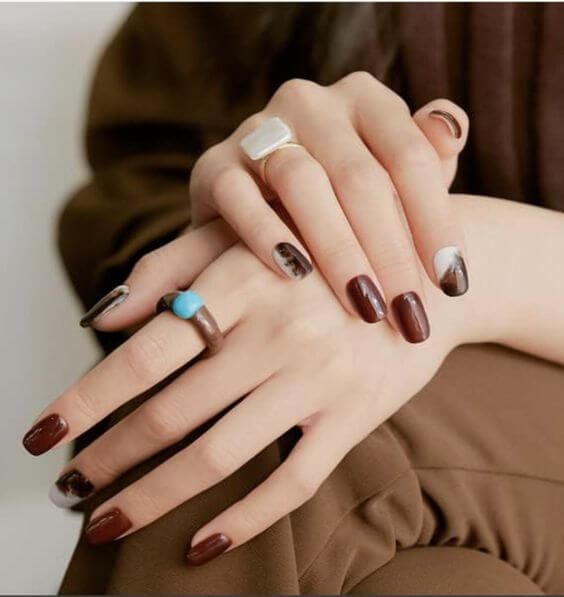 7 Best Products for Dark Red Nails: Polishes, Gel Nail Strips, and Press-On Nails 4. Gel Nail Strips Urban Cold Red Brown
ohora Semi Cured Gel Nail Strips (N Einspanner) provide a chic deep dark red-brown color. They offer a gel-like finish when used with a UV light.