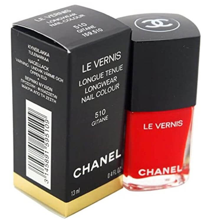 Unveiling the Elegance of Vibrant Red: Top 3 Red Nail Polishes 2.  Chanel 'Gitane' Chanel’s Le Vernis in ‘Gitane’ is the epitome of vibrancy and sophistication. In addition, it’s popular for darker skin tones.
Chanel Le Vernis Longwear Nail Colour - 510 Gitane