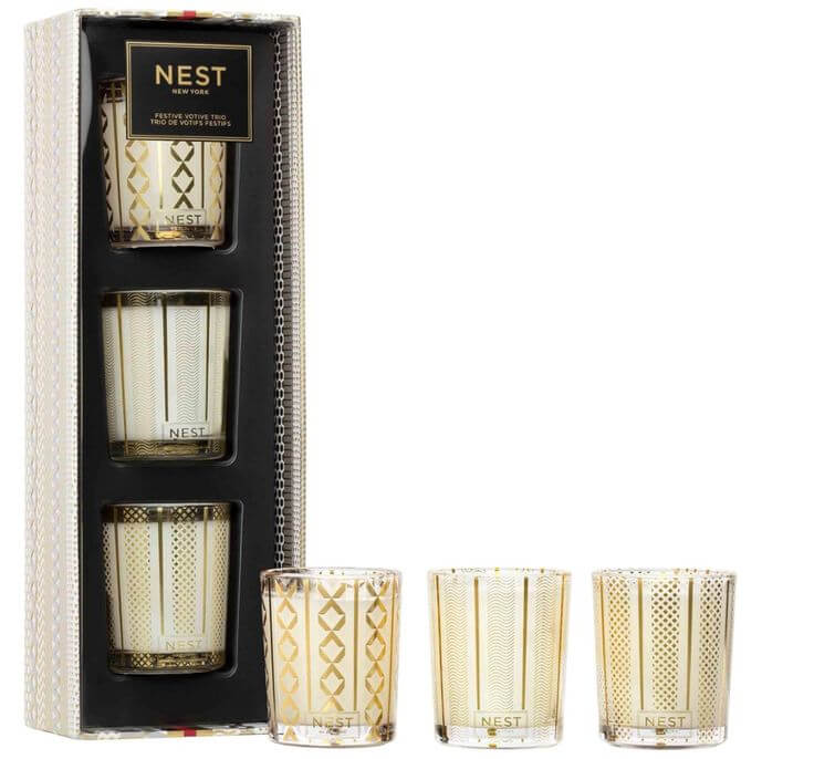 Top 5 Mini Candle Sets to Light Up Your Christmas 2. Great Addition To Home Decor: The Small Candle Trio from NEST New York Bring a burst of three distinct fragrances into your space with the NEST New York Festive Scented Votive Candle Trio. Enjoy the soft and warm scents of pine and vanilla from NEST. 
NEST New York Festive Scented Votive Candle Trio